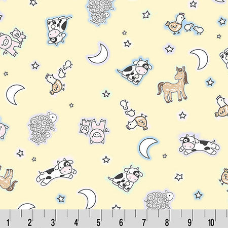 Children's fabric with animal and nature patterns on a yellow background